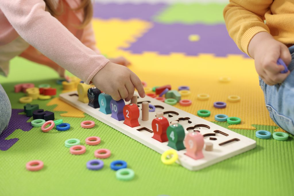 A child avoiding math at this age isn't necessarily a reflection of their ability; it can also be about confidence. A child who seems hesitant with math may benefit from more small, low-pressure opportunities to explore numbers and build confidence. Whether you're choosing a preschool in Singapore for the first time or wondering what's missing at your child's current one, the good news is that confidence can be built, both at home and in the right classroom. Here's what that actually looks like. How Can a Preschool Help Build a Child's Confidence in Math? Confidence in math can be built through small, frequent wins with real objects and everyday language, rather than relying solely on worksheets or repetitive practice. Children can begin exploring ideas about quantity, size, and patterns through ordinary play. A play-based preschool can build on these experiences, turning everyday moments into low-pressure opportunities to practise. Here's what that can look like. What Everyday Activities Build Number Sense? Simple, everyday moments can give children valuable opportunities to develop number sense. Counting steps on the way up the stairs, spotting numbers on lift buttons, or counting down while waiting for the bus are all everyday moments that build this skill. These are the kinds of small routines families can explore at home and through learning experiences in our preschools across Singapore. These moments work because they use real objects your child already understands, rather than abstract symbols on a page. You don't need special training or materials — the ordinary parts of your day are already full of opportunities. How Does Play-Based Learning Support Early Math Skills? Play does more than keep children entertained. Building with blocks, completing puzzles, and playing sorting games can give children opportunities to explore patterns, make comparisons, and engage in early problem-solving. At My Little Campus's preschools in Pasir Ris, Yishun, Bedok Reservoir, and Sembawang, our hands-on curriculum uses visual aids and physical materials through play-based learning to help children build these foundations naturally, as part of a broader focus on Mathematics, Science, English, and Mandarin. Why Does Praising Effort Matter More Than Getting the Right Answer? Praising effort matters more than getting the right answer because it helps children see mistakes as part of learning and encourages them to keep trying when math feels challenging. Instead of focusing only on whether your child gets the right answer, praise their effort and willingness to try. If your child is counting to ten but gets a number out of order, try praising them for trying rather than only celebrating a perfect count. Over time, this kind of encouragement can help children feel more comfortable trying something they're unsure about, building their confidence. What Should You Look for in a Preschool That Builds Early Math Skills? With so many preschools in Singapore to choose from, it helps to look past labels like "the best" and focus on what you can actually observe for yourself. What matters more is finding the best fit for your child, and that usually comes down to a few observable things: how teachers respond when a child gets something wrong, how much hands-on math material — such as counters, blocks, or number lines — is actually visible in the classroom, and whether the daily routine includes opportunities for play alongside more guided activities. These are things you can see for yourself, rather than take on faith from a brochure. How Do You Know If a Preschool's Curriculum Is Right for Your Child? A curriculum can look impressive in writing and still feel very different once you're standing in the classroom. Rather than relying on a prospectus, ask to see a sample daily schedule and pay attention to how academic activities and play are balanced throughout the day. It's something we're happy to walk parents through at any of our preschool locations. A visit lets you see these details for yourself, making it easier to decide whether the preschool feels like the right fit for your child. What Should You Ask During a Preschool Tour? A few specific questions can tell you more than a general tour ever will. Try asking how teachers respond when a child gets an answer wrong, how often hands-on materials like blocks or counters are used in a typical day, and what a normal math-related activity actually looks like for your child's age group. If you're near Bedok Reservoir, Pasir Ris, Sembawang, or Yishun, book a tour to ask us these questions in person. What Does Everyday Math Confidence Actually Look Like at Our Preschool? At My Little Campus, confidence looks less like getting every answer right and more like a child willing to try. It's a child attempting to count their own snacks without being asked twice, noticing on their own that the red blocks and blue blocks make a pattern, or saying "I can try" instead of "I can't" when something feels new. These small shifts build gradually, through repeated, low-pressure moments rather than any single lesson, which is exactly why the everyday environment around your child matters so much. Ready to See This in Action? If your child has been avoiding numbers or saying they're ‘not good at math,’ remember that this doesn't necessarily reflect their ability or mean they'll always feel this way. At My Little Campus, we build math confidence across all four of our centres through everyday play, encouragement, and plenty of hands-on practice. Find a centre near you to see this approach for yourself and meet the team who'll be working with your child.
